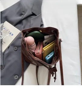 Top view showing large interior capacity of the brown faux leather bucket bag