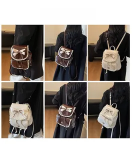 Fashionable women's bucket backpack featuring a decorative bow and lace trim details