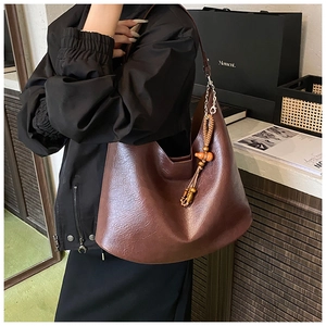 Deep brown retro PU leather hobo bag featuring a decorative wooden bead charm detail