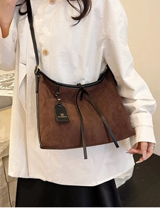 Brown faux suede tote bag with fringe details and black leather trim for women