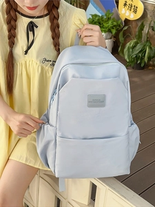 Light blue minimalist laptop backpack for students with large front zip pocket