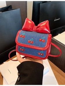 Mini crossbody bag with red leather, blue denim, cherry embroidery and a large red bow