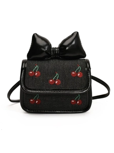 Mini crossbody bag with cherry embroidery and large glossy black bow on white background