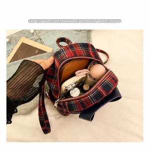 British style plaid backpack showing large capacity for phone, wallet and umbrella