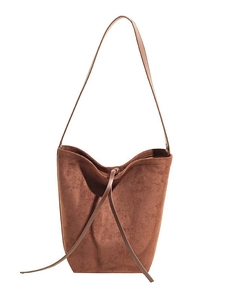 Minimalist brown suede bucket bag with long strap and drawstring in caramel finish