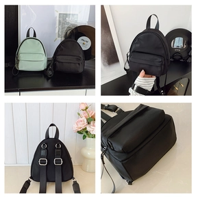 Detail view of mini nylon backpack with adjustable straps and front zip pocket