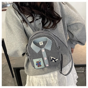 Detailed back view of a mini striped backpack featuring a unique blue shirt collar design