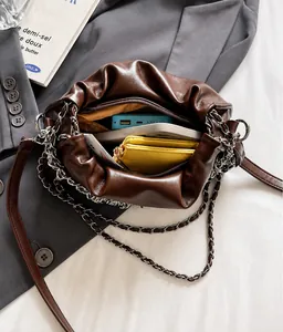 Deep brown ruched cloud bag showing spacious interior for phone and daily essentials