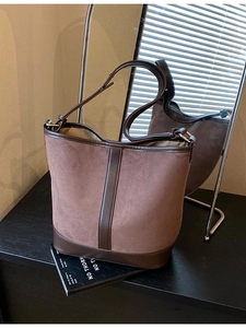 Retro matte suede bucket bag with contrast leather handles and adjustable shoulder strap