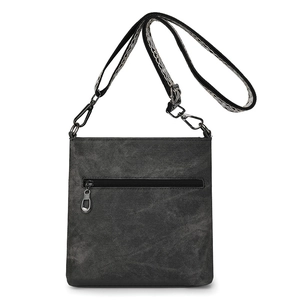 Detail of gray vintage canvas crossbody bag with jacquard strap and metallic hooks