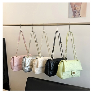 Detailed view of quilted PU chain bags in five vibrant colors with stylish metal lock