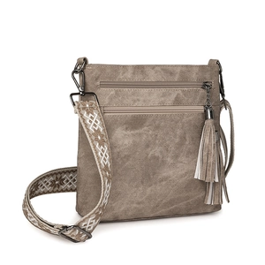 Detail of khaki crossbody bag with textured fabric, multi-zipper pockets and jacquard strap