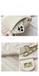 Detail view of cream quilted shoulder bag featuring gold chain strap and back phone pocket