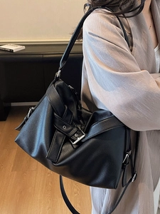 Minimalist black pebble leather tote bag with decorative belt buckle and large capacity