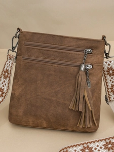 Brown vintage crossbody bag with dual zipper pockets and geometric wide strap on tan background