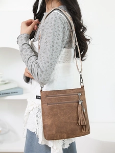 Brown vintage faux leather crossbody bag with ethnic embroidered strap and twin zippers