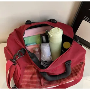 Interior view of large capacity dark red travel bag with bottle and accessories inside