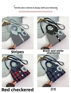 Detail view of creative shirt-style handbags featuring button collars and bear patches