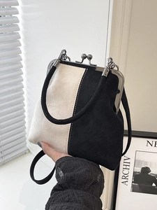 Vintage bicolour suede shell bag with silver metal frame and elegant top handle strap