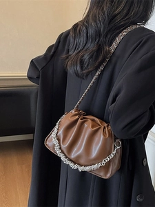 Fashionable dark brown ruched dumpling bag with silver chain and crossbody strap