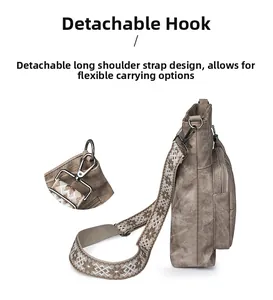 Detail of the detachable metal hook and ethnic patterned strap on the square crossbody bag