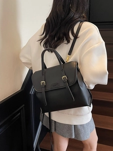 Black matte leather vintage backpack featuring a flap cover and adjustable straps