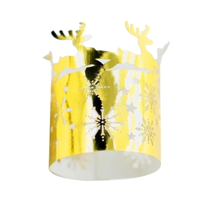 Detailed view of glossy gold Christmas napkin ring with reindeer and snowflake cutouts