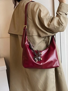 Vintage burgundy hobo shoulder bag in smooth faux leather with adjustable strap and horse charm