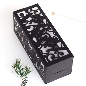 Laser-cut black paper lantern with graduation cap and scroll patterns for party decoration