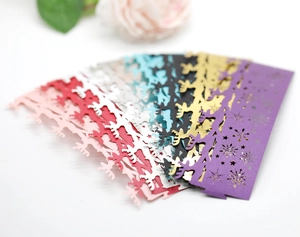 Macro shot of laser-cut snowflake and reindeer napkin rings in assorted vibrant colors