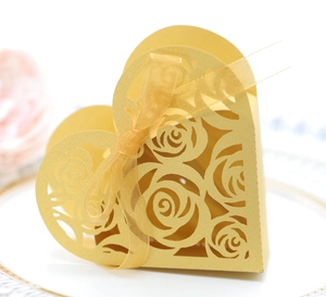 Golden heart-shaped laser-cut hollow rose candy box with gold ribbon for wedding decor