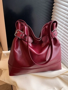 Chic burgundy leather tote bag with metallic buckle details for women's daily fashion