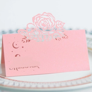 Pink laser-cut table place card with elegant rose hollow pattern for wedding seating