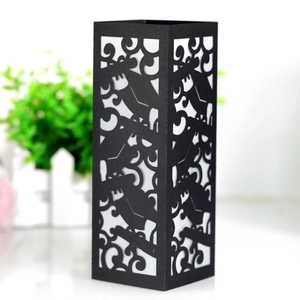 Macro view of black laser-cut hollow square lamp cover with intricate floral patterns