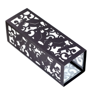 Intricate laser-cut black paper lantern with elegant scrollwork patterns for party decor