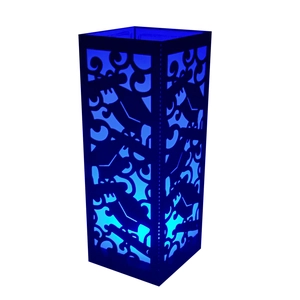 Detailed view of laser-cut black paper lampshade with abstract cloud pattern and blue light