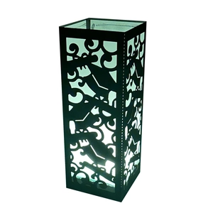 Detail of laser-cut black lampshade with fluid patterns and internal LED light effect