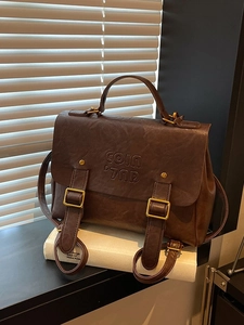 Vintage brown PU leather backpack with gold buckles and COIN 7NP embossed logo