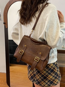 Vintage dark brown leather-textured backpack for women with embossed COIN '7ND logo