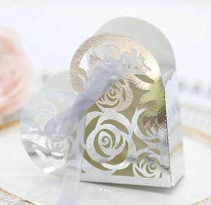Detailed laser cut hollow rose pattern on silver hollow heart wedding candy gift box