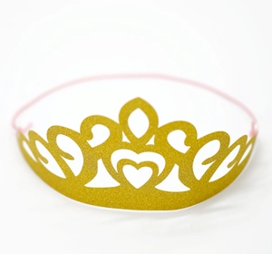 Glittering gold party crown with heart cutouts and pink elastic strap for birthdays