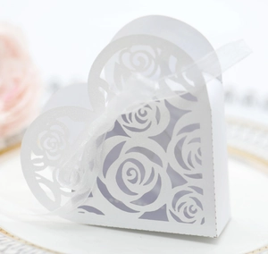 Elegant laser cut heart wedding favor box with white rose pattern and organza ribbon