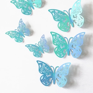 Detailed view of 3D teal butterfly wall stickers with intricate hollow lace cutouts