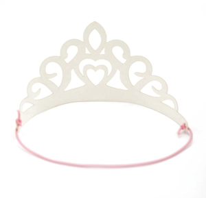 Close-up of laser-cut heart pattern on white foam crown with pink elastic strap