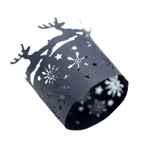 Laser-cut black paper napkin rings with Christmas reindeer and snowflake hollow patterns