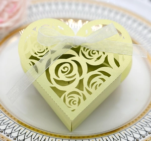 Macro detail of heart-shaped laser-cut gift box with floral patterns and ribbon