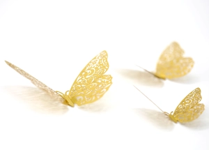 Detailed view of 3D gold hollow butterfly wall stickers with intricate laser-cut patterns