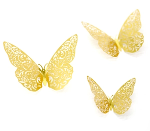 Macro shot of gold 3D hollow butterfly wall stickers with intricate laser-cut patterns