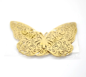 Detail view of gold 3D laser-cut butterfly wall stickers with intricate patterns
