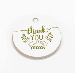 White circular gift tag with green floral leaves and 'Thank You So Much' elegant lettering